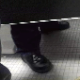 A camera placed under the stall in a public restroom captures several women sitting on the toilet. Presented in 720P HD video.